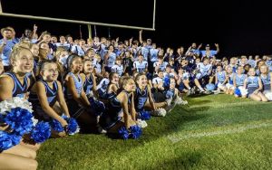  Image of cheerleaders and football team after winning the 2021 WMAA County Championship